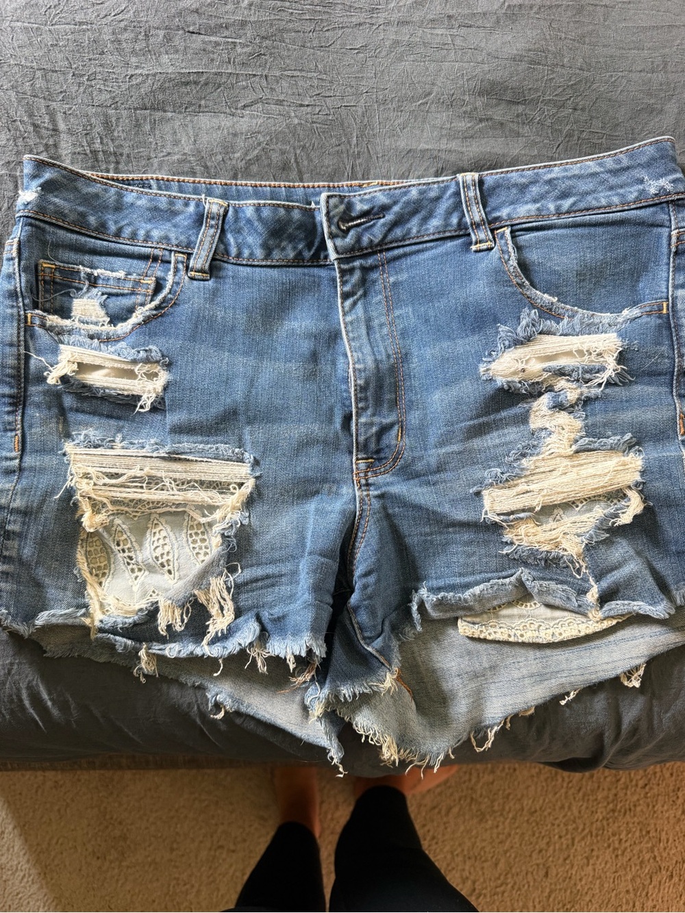 Distressed Blue Denim Women’s Shorts with Lace Insets